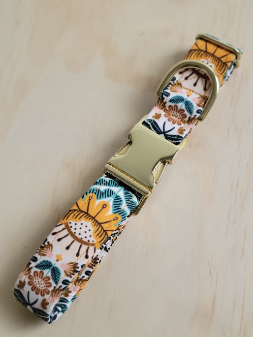 high quality cotton and steel fabric, vintage looking folk florals in mustard yellow, ochre, and seafoam green leaves, centered on collar