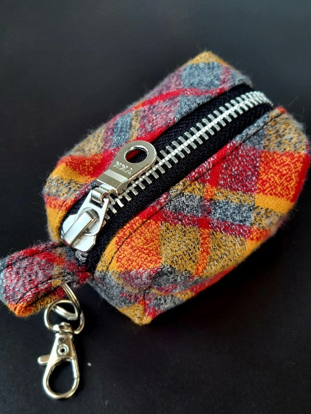 red and yellow plaid flannel, kansas city chiefs themed poop bag holder