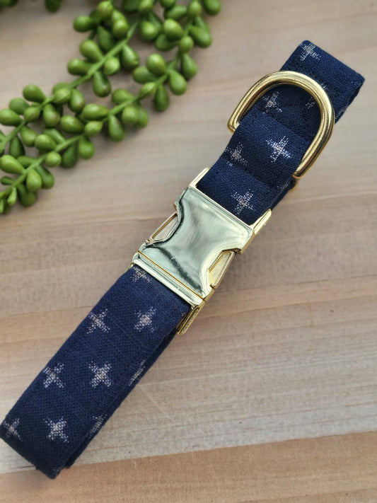 navy blue dog collar with taupe swiss crosses, gold hardware