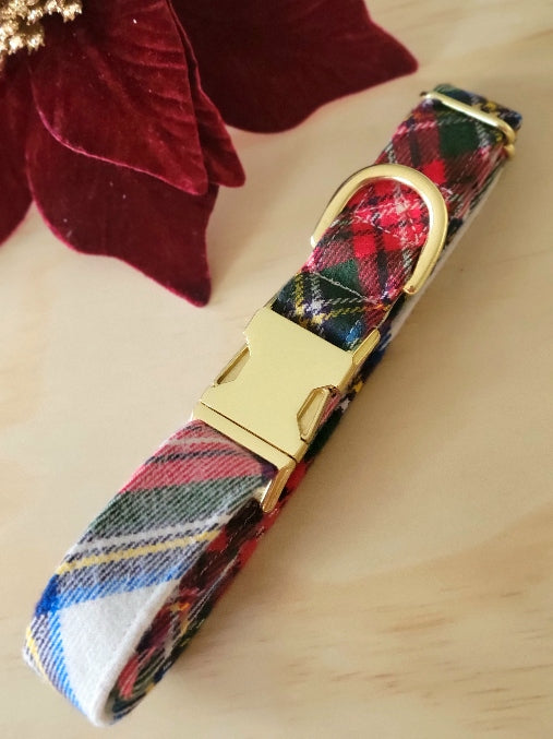 stewart plaid flannel in traditonal christmas plaid pattern, plaid stripes in bright pops of red, blue, yellow, green and black on an ivory background, plaid on the bias, handmade dog collar shown with gold metal hardware