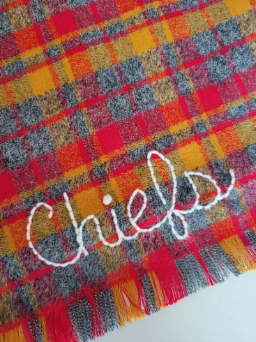 red and yellow kansas city chiefs themed dog bandana , option to add custom name, hand embroidered, shown with "chiefs" in a cursive script