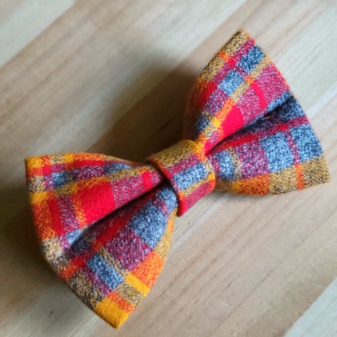 red and yellow plaid flannel on medium gray background, kansas city chiefs themed dog bow tie
