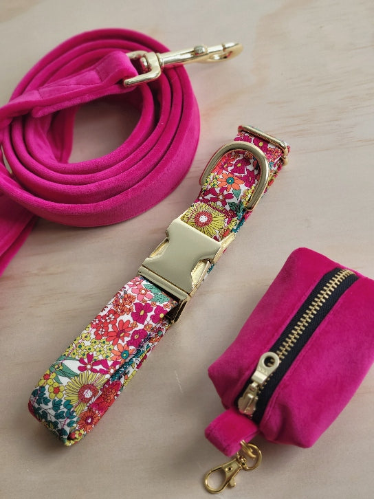 gorgeous liberty of london high end fabric collar in bright multicolor floral. Florals have a vintage look to them. Paired with our high quality, soft, coordinating hot pink velvet leash and waste bag holder. 