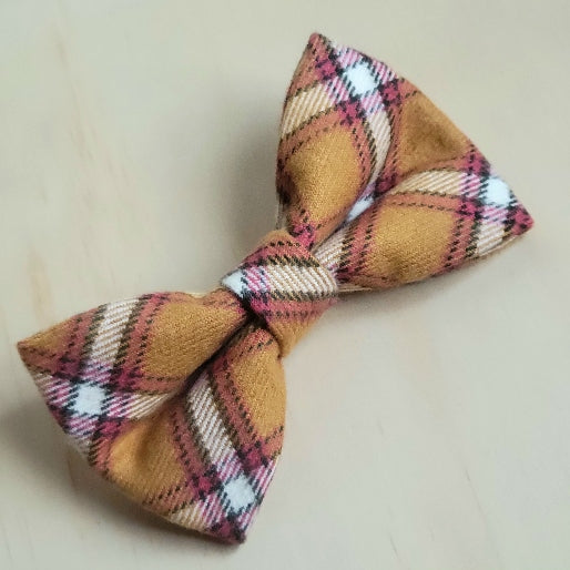 muted mustard yellow, muted red, white and black plaid flannel dog bow tie. classic appearance and perfect for any chiefs fan
