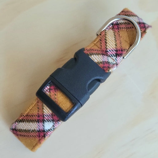 Kansas City Chiefs themed dog collar in muted mustard yellow and white, black, and muted red plaid stripe. Made with cotton flannel and shown with hard black plastic buckle