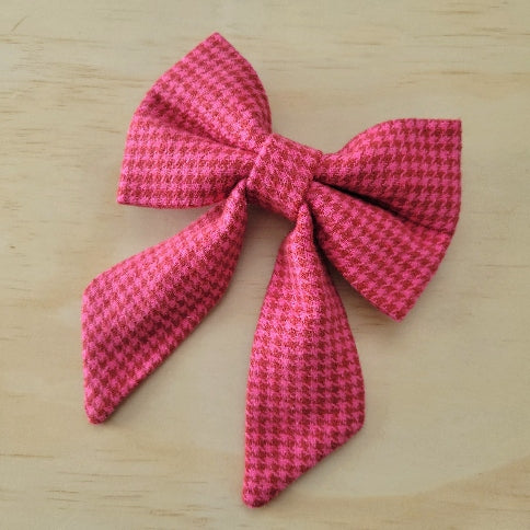 barbie pink and red houndstooth fancy girl dog bow perfect for any barbie fan or valentines day. made with soft cotton flannel