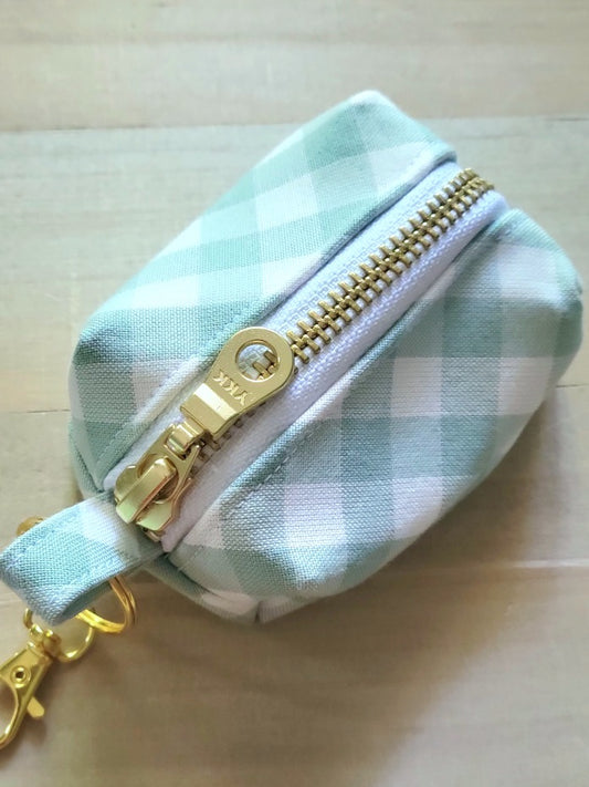 sage green gingham poop bag holder with gold metal zipper and clasp