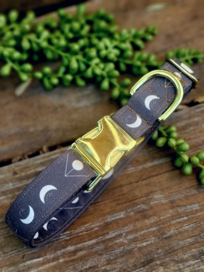 moon phases dog collar. moons appear in different phases in white and yellow details on a dark gray background. moons have been centered on collar for best appearance.