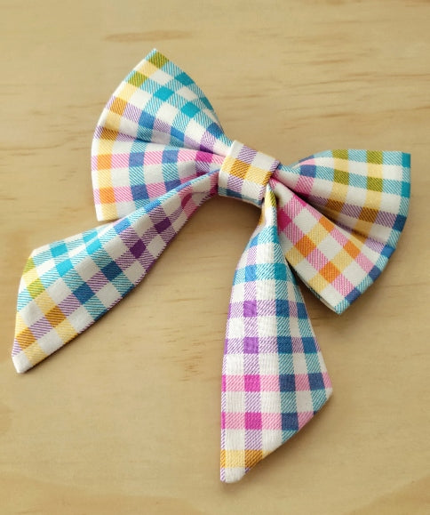 bright blue, purple, yellow and pink on a white background gingham plaid girl dog fancy bow, over the collar design, perfect for easter