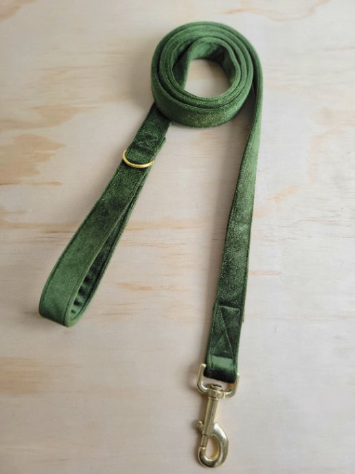 fancy moss green velvet dog leash, shown in 1" wide with shiny gold metal hardware. velvet is a medium muted olive green, popular for spring or year round. it is soft, luxurious and has a lovely sheen.