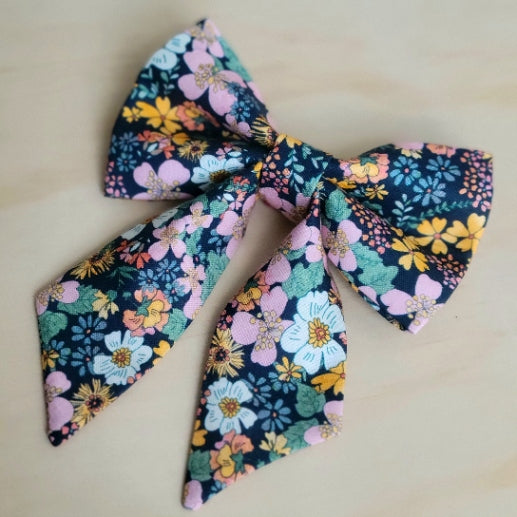 vintage inspired 70s florals in multicolor pastel flowers, dark background, fancy girl dog bow