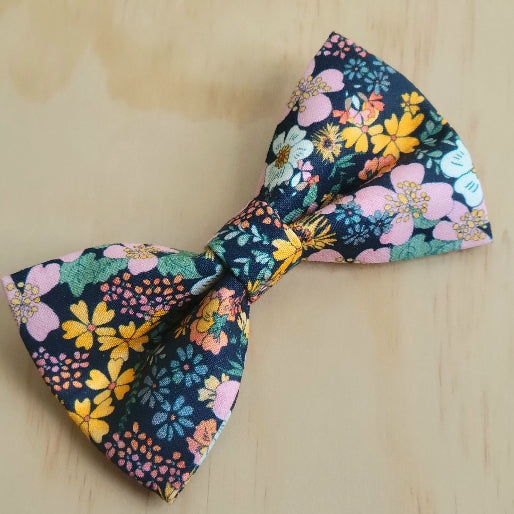 vintage inspired 70s florals in bright multicolor pastel flowers, dark background, dog bow tie. handmade in kansas city,