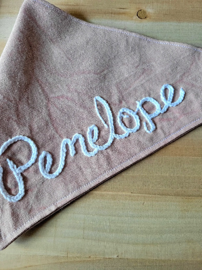 close up of hand embroidered name in cursive