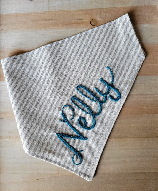 beige and white striped canvas dog bandana, customized with hand embroidered name