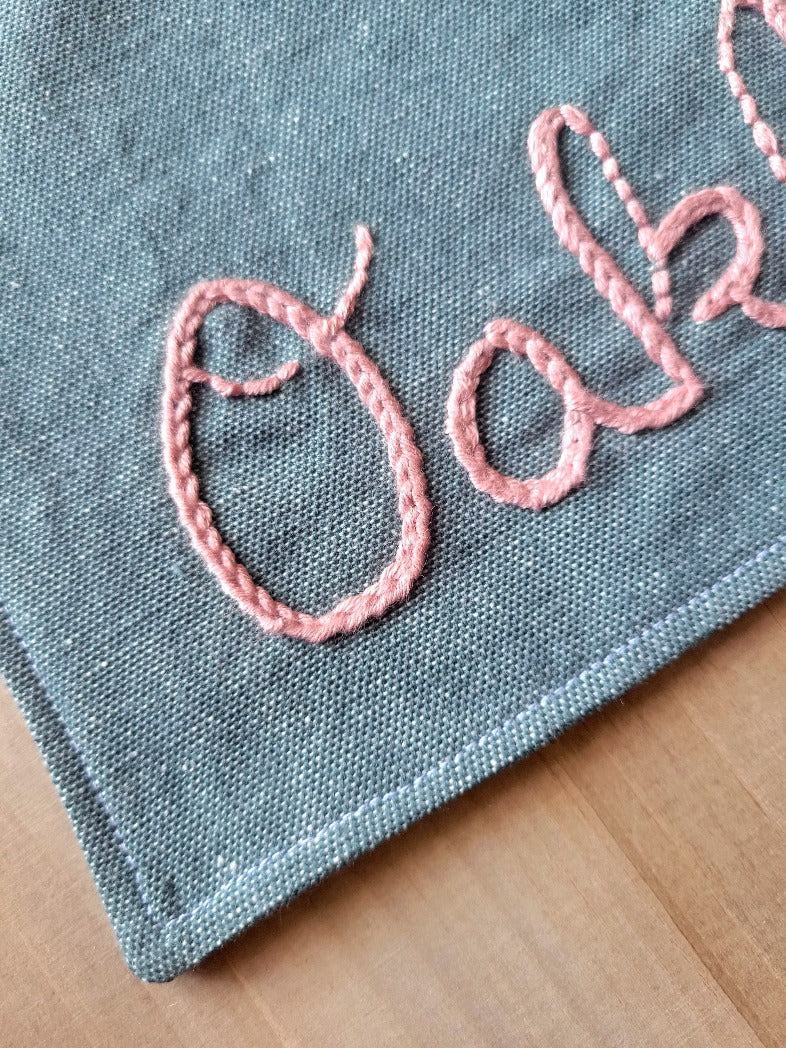 close up of hand stitching on dog bandana