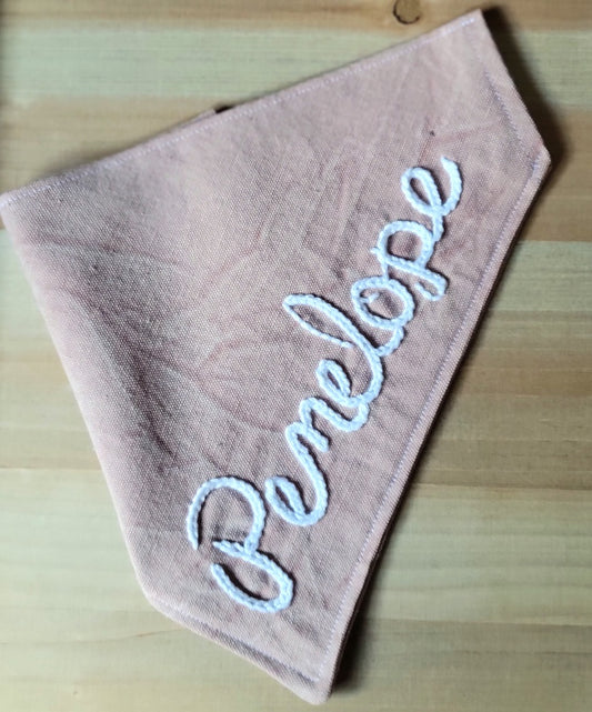 blush pink canvas dog bandana, distressed finish, customized with hand embroidered name in cursive