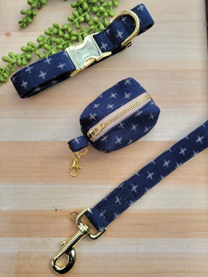 dark navy blue with beige swiss crosses dog collar, leash, and waste bag set